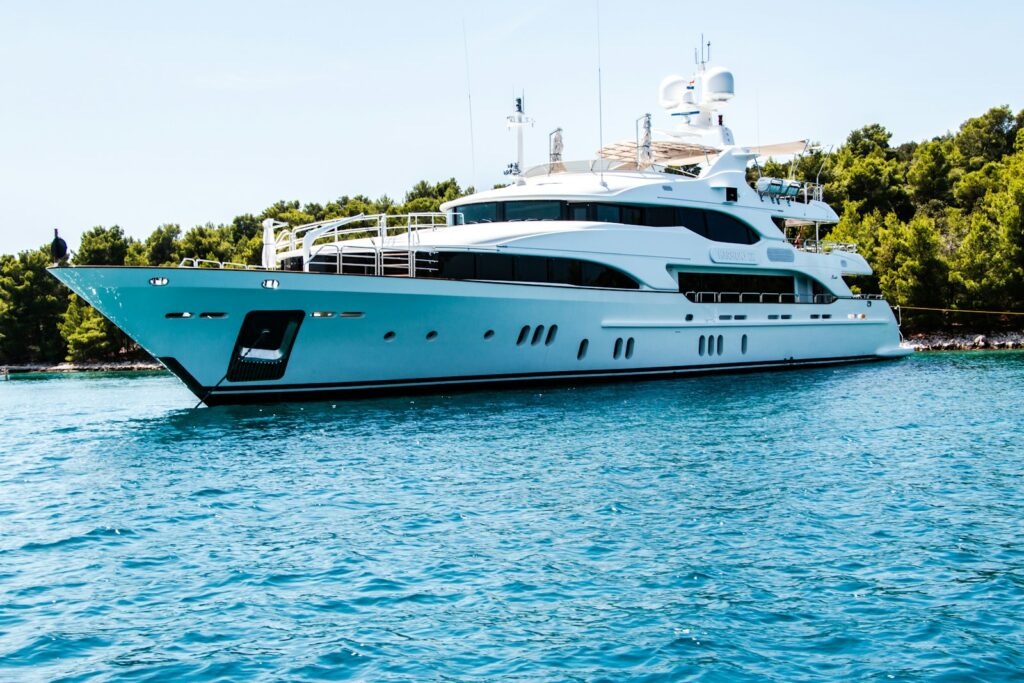 Motor yacht cruising on blue water, illustrating marine insurance for vessels